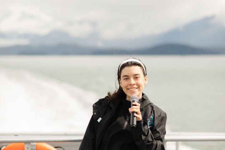 a man standing in front of water