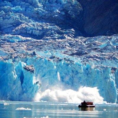 a group of ice water and a mountain in the background