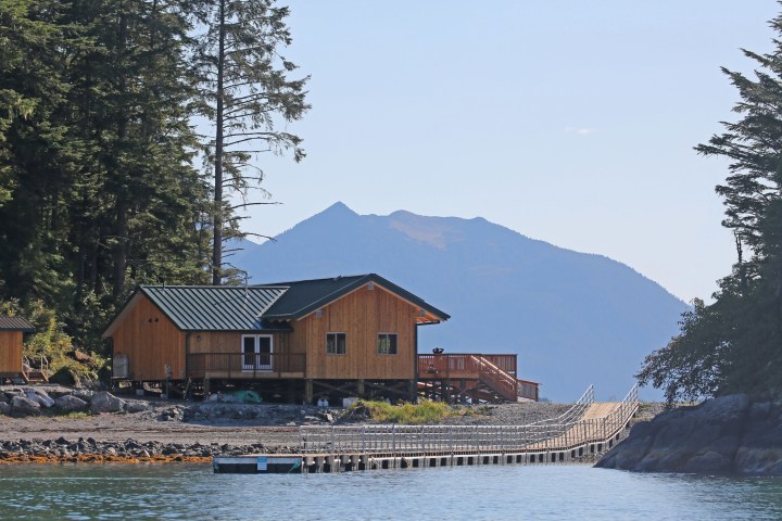 a boat is docked next to a body of water