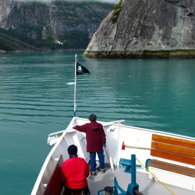 a group of people in a boat on a body of water
