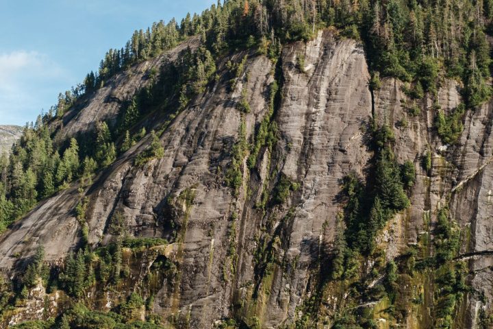 a large waterfall over a body of water