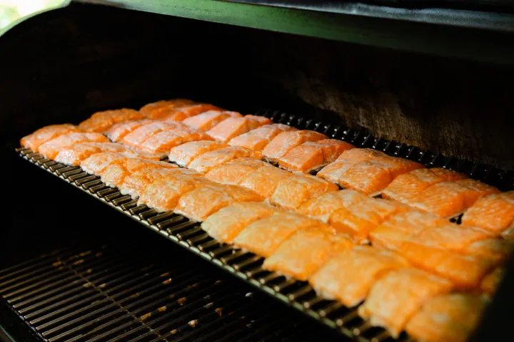 a pizza sitting on a grill