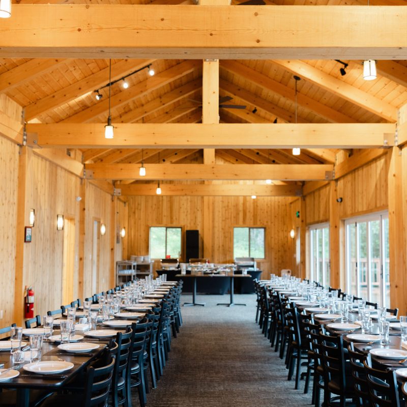 a row of wooden benches sitting on top of a table