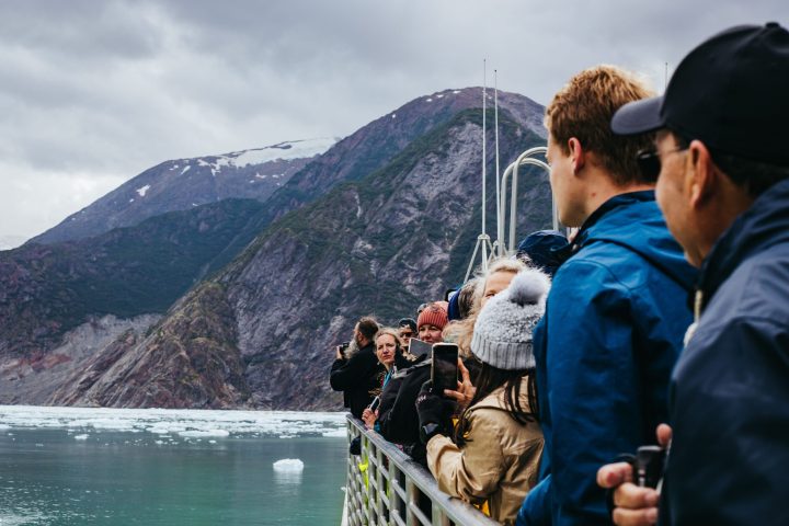 a group of people standing on top of a mountain