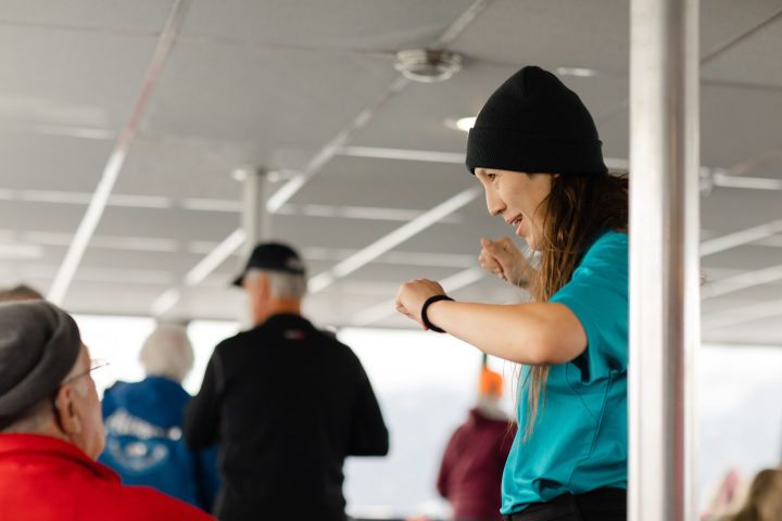 a group of people standing next to a person