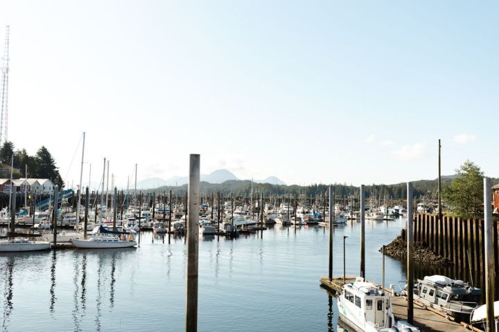 a boat is docked next to a body of water