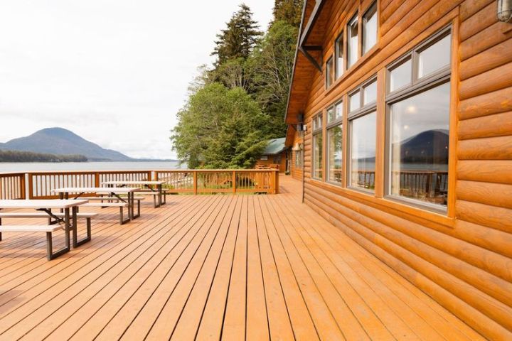 a group of people walking on a wooden bench