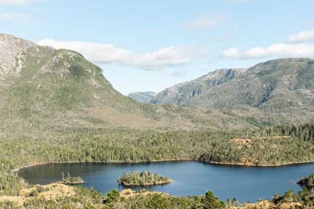 a body of water with a mountain in the background
