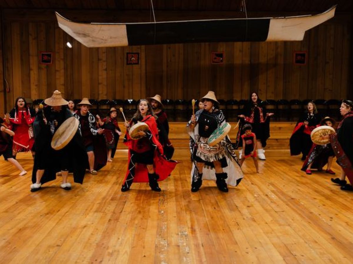 a group of people standing in a room