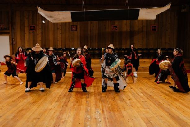 a group of people standing in a room