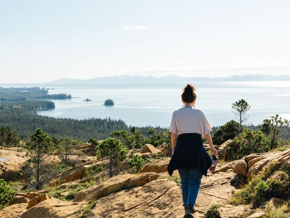 a man standing on a rocky hill