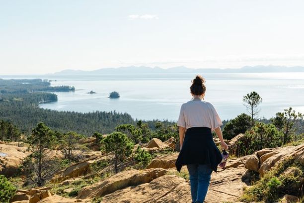 a man standing on a rocky hill